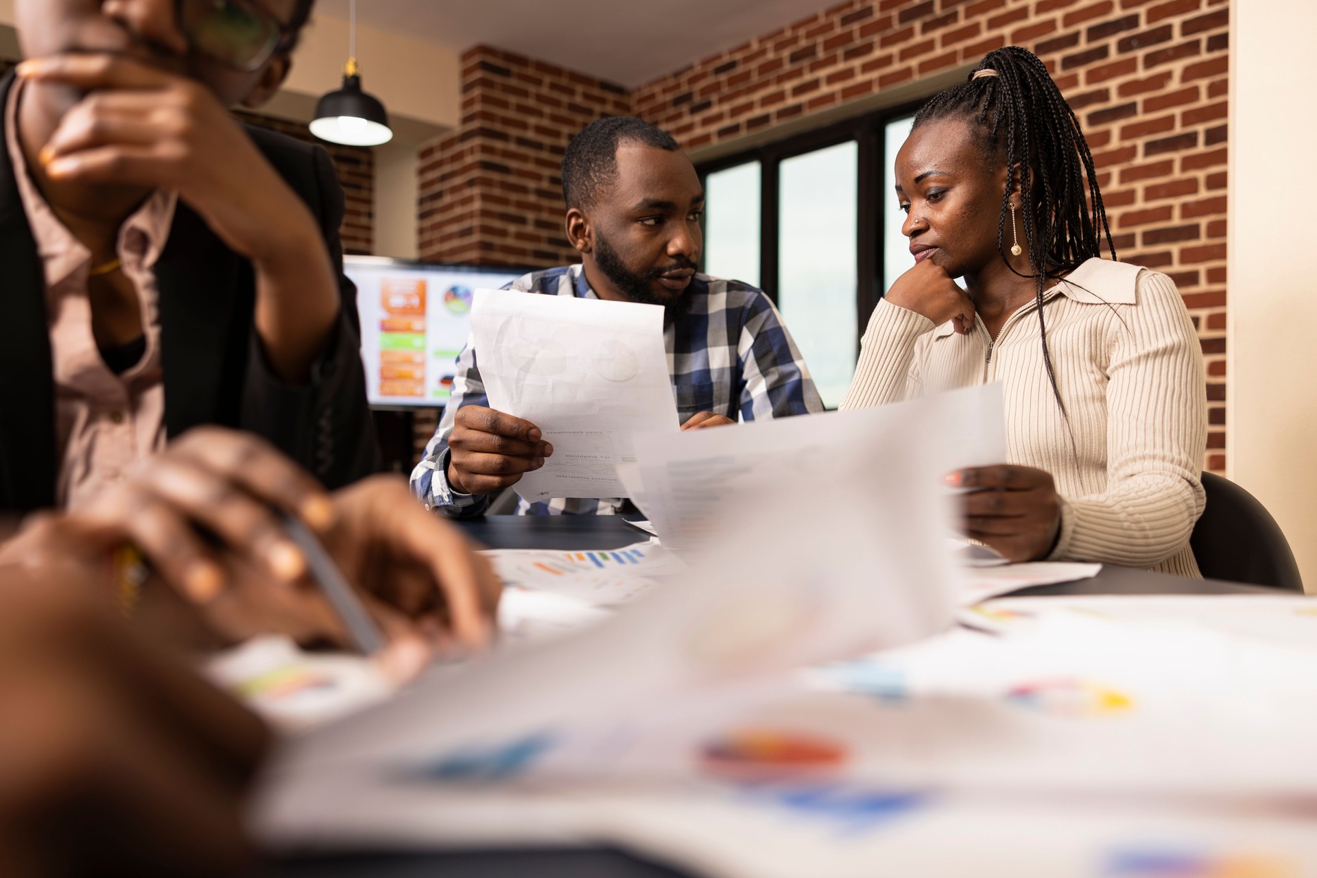 Black professionals Analyzing Project Data